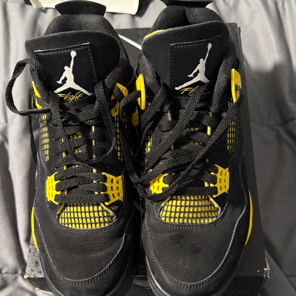 Jordan 4 Retro Black and Yellow Athletic Sneakers